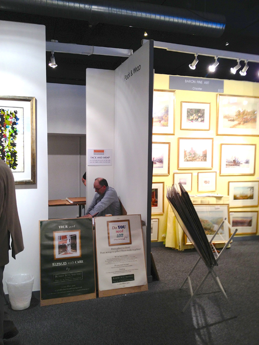 The wrapping booth at the Watercolour and Works on Paper Fair, which reported a steady dream of purchasers wanting its services on the fair's opening day. Image Auction Central News.